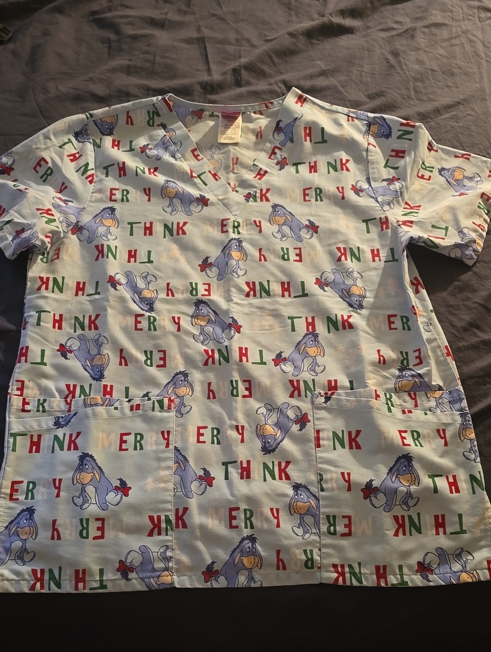Disney Eeyore Holiday Print Short Sleeve Scrub Top - Light Blue, Red, Green